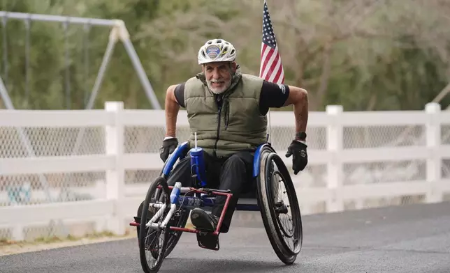 Rick Bingham, 87 trains for the LA Marathon on a wheelchair on his ranch in Lake Elsinore, Calif., Tuesday, March 11, 2025. (AP Photo/Damian Dovarganes)