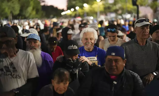 Runners prepare for the start of the Los Angeles Marathon Sunday, March 16, 2025, in Los Angeles. (AP Photo/Eric Thayer)