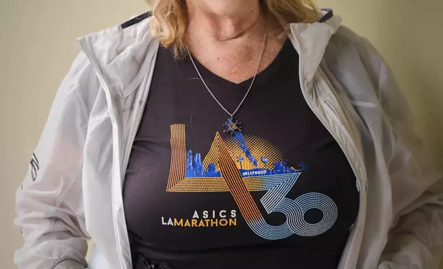 Sharon Kerson, 83, poses for a photo while training at the West Los Angeles College track in Culver City, Calif., Thursday, March 13, 2025. (AP Photo/Damian Dovarganes)