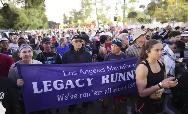 Members of the Legacy Runners gather at the start of the Los Angeles Marathon Sunday, March 16, 2025, in Los Angeles. (AP Photo/Eric Thayer)