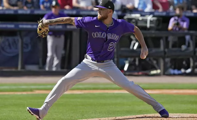 Colorado Rockies' Kyle Freeland goes into his windup against the Tampa Bay Rays during the first inning of a baseball game Friday, March 28, 2025, in Tampa, Fla. (AP Photo/Chris O'Meara)
