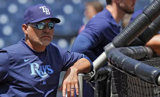 Tampa Bay Rays manager Kevin Cash watches betting practice before a baseball game against the Colorado Rockies Friday, March 28, 2025, in Tampa, Fla. (AP Photo/Chris O'Meara)