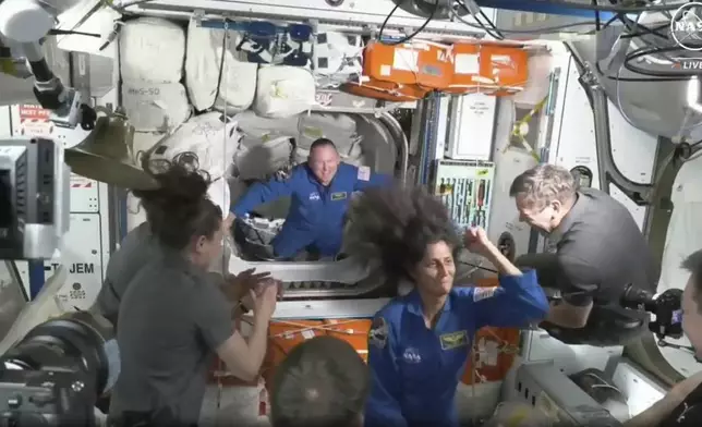 FILE - NASA astronauts Butch Wilmore and Suni Williams are greeted by the crew of the International Space Station upon their arrival on Thursday, June 6, 2024. (NASA via AP, File)