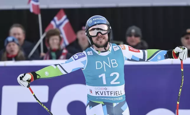 Slovenia's Miha Hrobat reacts after completing an alpine ski, men's World Cup downhill, in Kvitfjell, Norway, Saturday, March 8, 2025. (AP Photo/Marco Trovati)