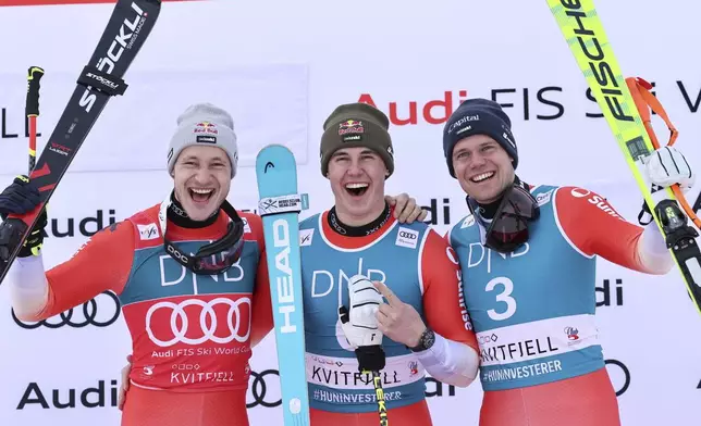 From left, second placed Switzerland's Marco Odermatt, the winner Switzerland's Franjo von Allmen and third placed Switzerland's Stefan Rogentin celebrate after an alpine ski, men's World Cup downhill, in Kvitfjell, Norway, Saturday, March 8, 2025. (AP Photo/Marco Trovati)