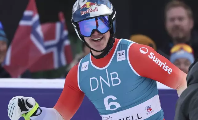 Switzerland's Franjo von Allmen reacts after completing an alpine ski, men's World Cup downhill, in Kvitfjell, Norway, Saturday, March 8, 2025. (AP Photo/Marco Trovati)