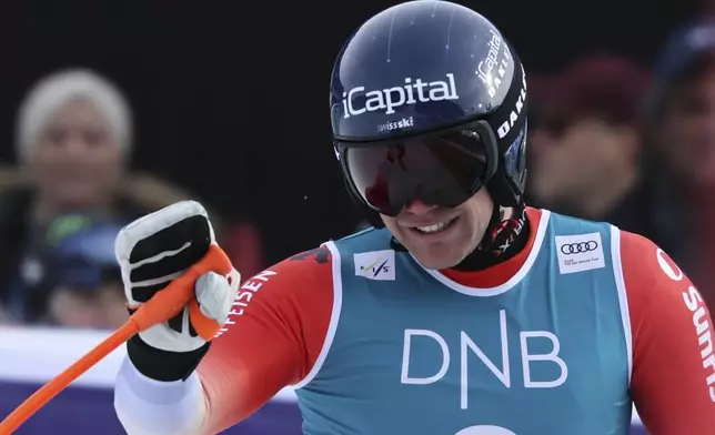 Switzerland's Stefan Rogentin reacts after completing an alpine ski, men's World Cup downhill, in Kvitfjell, Norway, Saturday, March 8, 2025. (AP Photo/Marco Trovati)