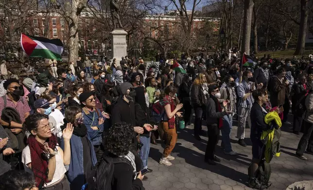 A protester including students of New York University gather for a demonstration in support of Palestinian activist Mahmoud Khalil at Washington Square Park, Tuesday, March 11, 2025, in New York. (AP Photo/Yuki Iwamura)