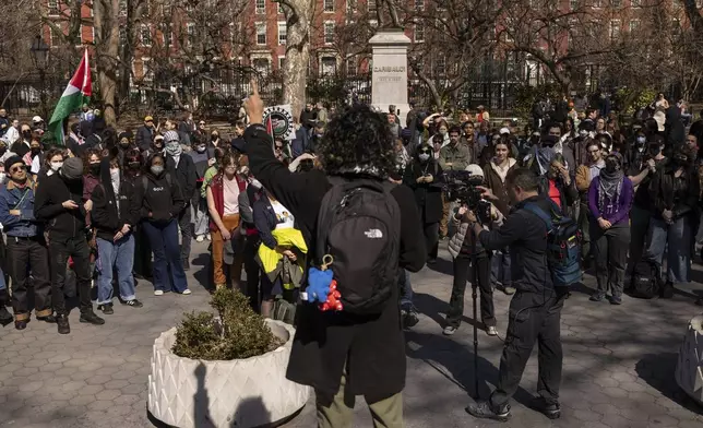 A protester including students of New York University gather for a demonstration in support of Palestinian activist Mahmoud Khalil at Washington Square Park, Tuesday, March 11, 2025, in New York. (AP Photo/Yuki Iwamura)
