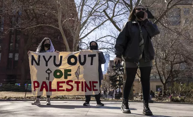 A protester including students of New York University gather for a demonstration in support of Palestinian activist Mahmoud Khalil at Washington Square Park, Tuesday, March 11, 2025, in New York. (AP Photo/Yuki Iwamura)