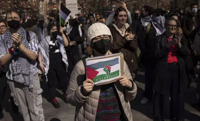 A protester including students of New York University gather for a demonstration in support of Palestinian activist Mahmoud Khalil at Washington Square Park, Tuesday, March 11, 2025, in New York. (AP Photo/Yuki Iwamura)