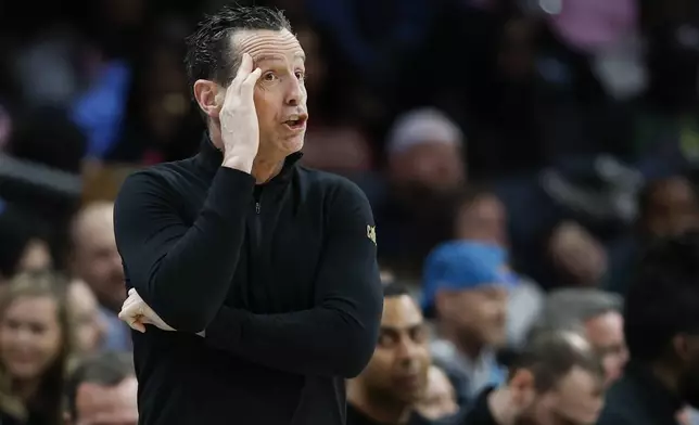 Cleveland Cavaliers head coach Kenny Atkinson calls a play during the first half of an NBA basketball game against the Charlotte Hornets in Charlotte, N.C., Friday, March 7, 2025. (AP Photo/Nell Redmond)