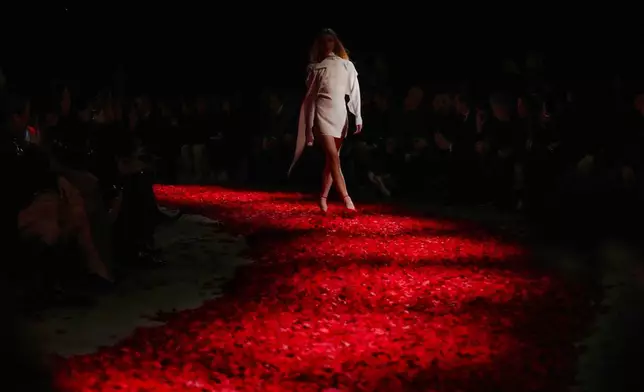 Models wear creations as part of the Ferragamo's Fall/Winter 2025-2026 collection presented in Milan, Italy, Saturday, March 1, 2025. (AP Photo/Antonio Calanni)