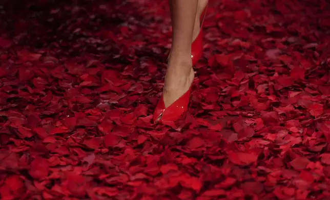 Models wear creations as part of the Ferragamo's Fall/Winter 2025-2026 collection presented in Milan, Italy, Saturday, March 1, 2025. (AP Photo/Antonio Calanni)