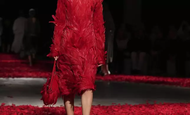 Models wear creations as part of the Ferragamo's Fall/Winter 2025-2026 collection presented in Milan, Italy, Saturday, March 1, 2025. (AP Photo/Antonio Calanni)