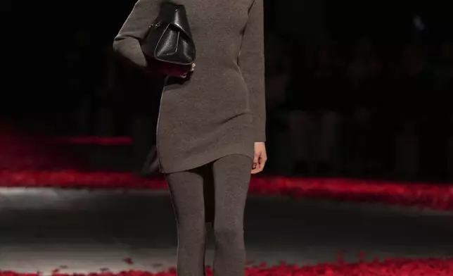 Models wear creations as part of the Ferragamo's Fall/Winter 2025-2026 collection presented in Milan, Italy, Saturday, March 1, 2025. (AP Photo/Antonio Calanni)