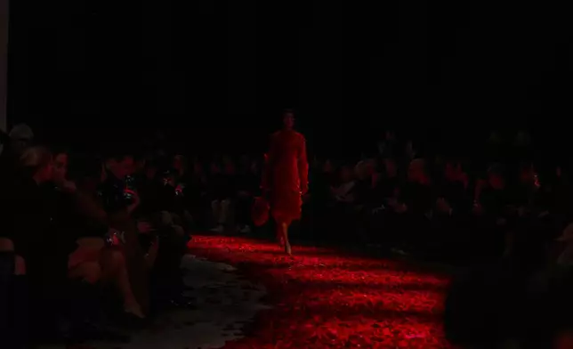 Models wear creations as part of the Ferragamo's Fall/Winter 2025-2026 collection presented in Milan, Italy, Saturday, March 1, 2025. (AP Photo/Antonio Calanni)