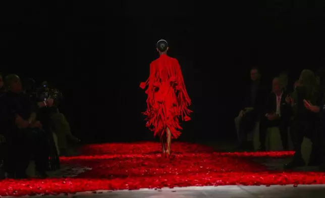 Models wear creations as part of the Ferragamo's Fall/Winter 2025-2026 collection presented in Milan, Italy, Saturday, March 1, 2025. (AP Photo/Antonio Calanni)