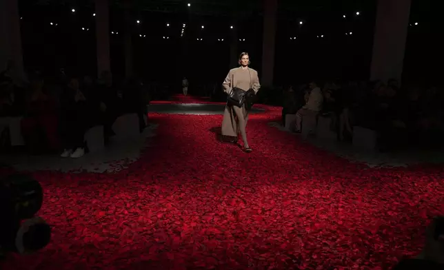 Models wear creations as part of the Ferragamo's Fall/Winter 2025-2026 Womenswear collection presented in Milan, Italy, Saturday, March 1, 2025. (AP Photo/Antonio Calanni)