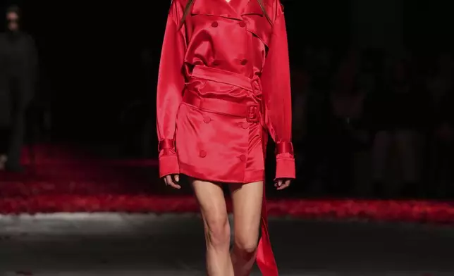 Models wear creations as part of the Ferragamo's Fall/Winter 2025-2026 collection presented in Milan, Italy, Saturday, March 1, 2025. (AP Photo/Antonio Calanni)