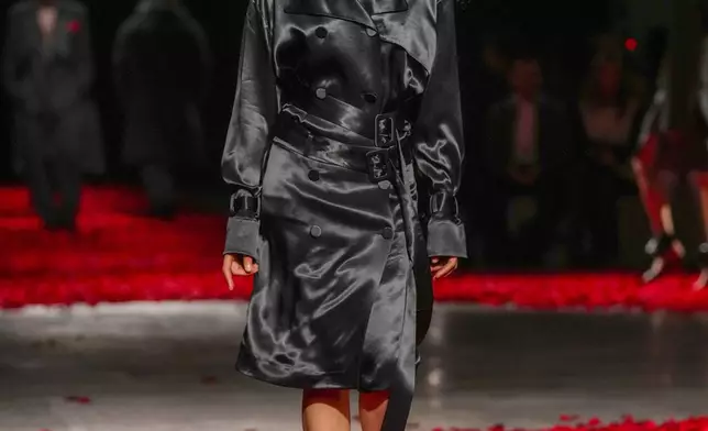 Models wear creations as part of the Ferragamo's Fall/Winter 2025-2026 collection presented in Milan, Italy, Saturday, March 1, 2025. (AP Photo/Antonio Calanni)