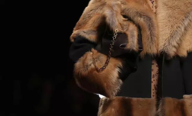 Models wear creations as part of the Ferragamo's Fall/Winter 2025-2026 collection presented in Milan, Italy, Saturday, March 1, 2025. (AP Photo/Antonio Calanni)