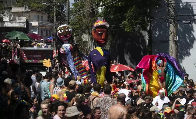 Revelers attend the Carmelitas street party on the first official day of Carnival in Rio de Janeiro, Friday, Feb. 28, 2025. (AP Photo/Bruna Prado)