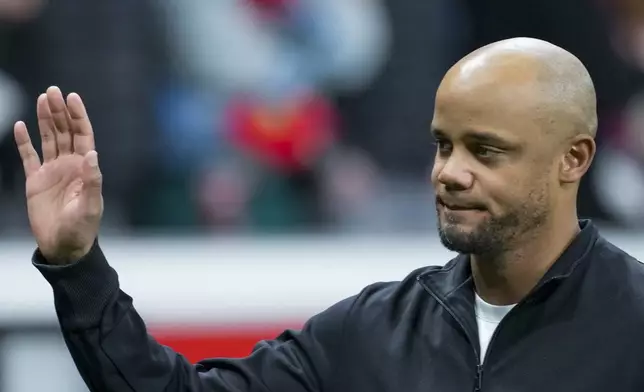 Bayern's head coach Vincent Kompany greets fans prior the Champions League round of 16 second leg soccer match between Bayer Leverkusen and Bayern Munich at the BayArena in Leverkusen, Germany, Tuesday, March 11, 2025. (AP Photo/Martin Meissner)