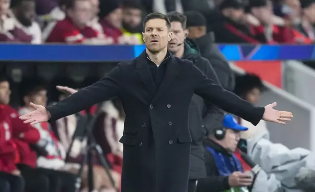 Leverkusen's head coach Xabi Alonso reacts during the Champions League round of 16 second leg soccer match between Bayer Leverkusen and Bayern Munich at the BayArena in Leverkusen, Germany, Tuesday, March 11, 2025. (AP Photo/Martin Meissner)