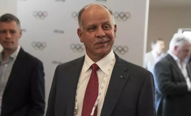 Candidate to the presidency of the IOC Prince Feisal Al-Hussein arrives at the mixed zone during a break of the 144th session, which will elect the new IOC President, in Costa Navarino, western Greece, Wednesday, March 19, 2025. (AP Photo/Thanassis Stavrakis)