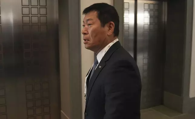 Candidate to the presidency of the International Olympic Committee Morinari Watanabe arrives at the mixed zone during a break of the 144th session, which will elect the new IOC President, in Costa Navarino, western Greece, Wednesday, March 19, 2025. (AP Photo/Thanassis Stavrakis)