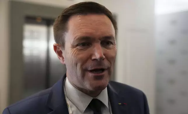 Candidate to the presidency of the International Olympic Committee David Lappartient makes statements to the reporters during a break of the 144th session, which will elect the new IOC President, in Costa Navarino, western Greece, Wednesday, March 19, 2025. (AP Photo/Thanassis Stavrakis)