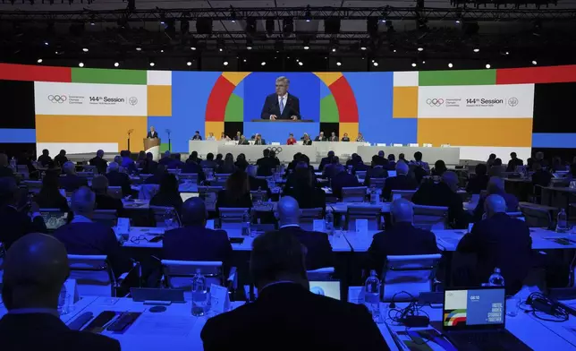 International Olympic Committee President Thomas Bach speaks during the 144th session which will elect the new IOC President, in Costa Navarino, western Greece, Wednesday, March 19, 2025. (AP Photo/Thanassis Stavrakis)