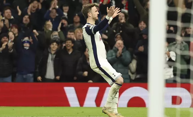 Tottenham's James Maddison celebrates after he scored his side's second goal during the Europa League round of 16 second leg soccer match between Tottenham Hotspur and AZ Alkmaar at the Tottenham Hotspur stadium in London, Thursday, March 13, 2025. (AP Photo/Ian Walton)