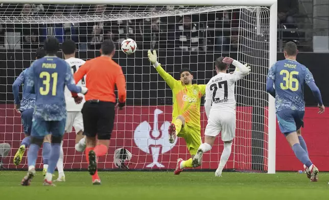 Frankfurt's Mario Goetze, second right, scores his side's second goal during the Europa League round of 16 second leg soccer match between Eintracht Frankfurt and Ajax at Deutsche Bank Park, in Frankfurt, Germany, Thursday, March 13, 2025. (AP Photo/Michael Probst)