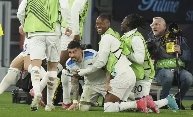 Lazio's Alessio Romagnoli celebrates with his teammates after scoring his side's first goal during the Europa League round of 16 first leg soccer match between Lazio and Viktoria Plzen, at Rome's Olympic Stadium, Thursday, March 13, 2025. (AP Photo/Andrew Medichini)