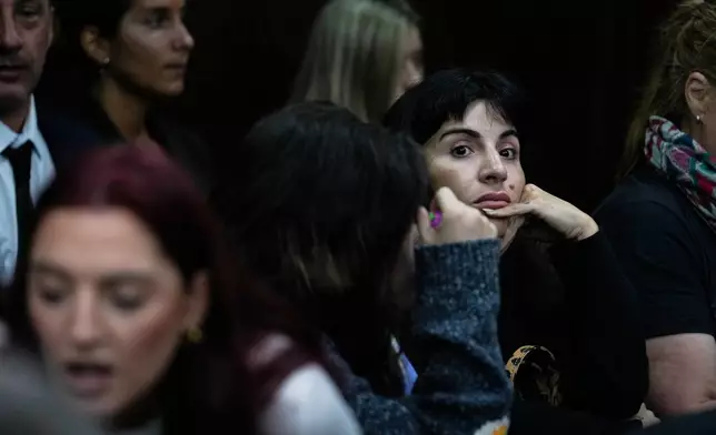 Yanina Maradona, daughter of late soccer star Diego Maradona, sits in court on the first day of a trial for alleged homicide by negligence against the medical team that treated her father, in San Isidro on the outskirts of Buenos Aires, Argentina, Tuesday, March 11, 2025. (AP Photo/Natacha Pisarenko)