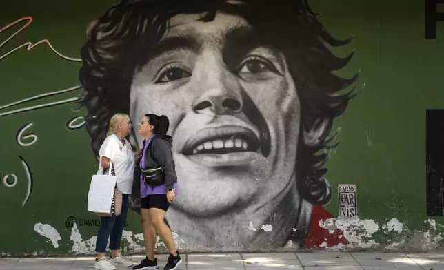 A mural of late soccer star Diego Maradona covers a wall in the La Paternal neighborhood of Buenos Aires, Argentina, Tuesday, March 11, 2025. (AP Photo/Rodrigo Abd)