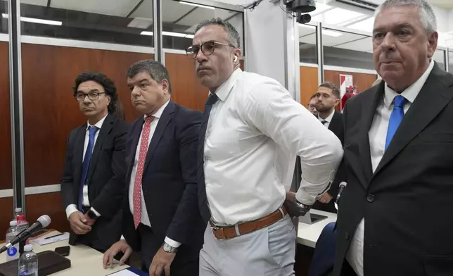 Neurologist Leopoldo Luque, who served as Diego Maradona's doctor, stands in court on the first day of a trial for alleged homicide by negligence against the medical team who treated the late soccer star in San Isidro on the outskirts of Buenos Aires, Argentina, Tuesday, March 11, 2025. (AP Photo/Natacha Pisarenko)