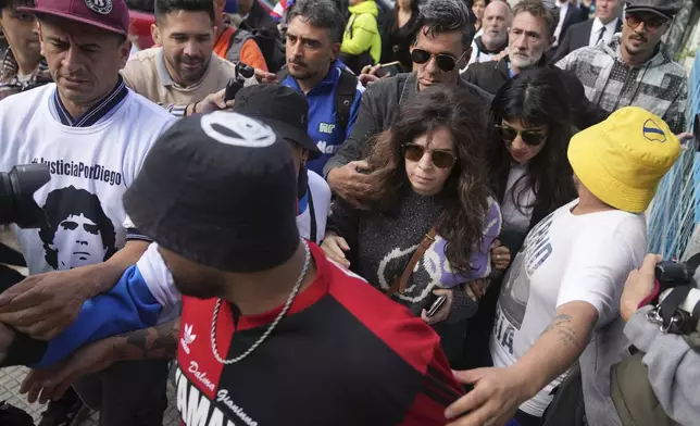 Dalma and Yanina Maradona, daughters of late soccer star Diego Maradona, arrive at court on the first day of a trial for homicide by negligence against the medical team that treated their father, in San Isidro on the outskirts of Buenos Aires, Argentina, Tuesday, March 11, 2025. (AP Photo/Natacha Pisarenko)