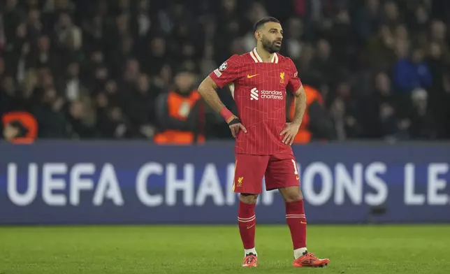 Liverpool's Mohamed Salah stands on the pitch during the Champions League round of 16 first leg soccer match between Paris Saint-Germain and Liverpool at the Parc des Princes in Paris, Wednesday, March 5, 2025. (AP Photo/Aurelien Morissard)