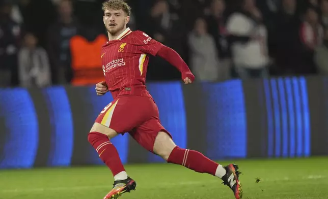 Liverpool's Harvey Elliott scores the opening goal during the Champions League round of 16 first leg soccer match between Paris Saint-Germain and Liverpool at the Parc des Princes in Paris, Wednesday, March 5, 2025. (AP Photo/Aurelien Morissard)