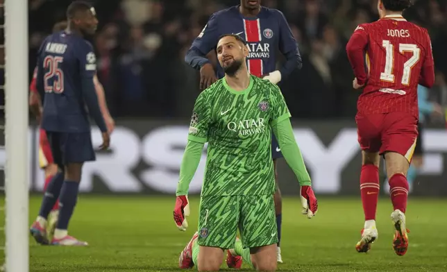 PSG's goalkeeper Gianluigi Donnarumma reacts after conceding the opening goal during the Champions League round of 16 first leg soccer match between Paris Saint-Germain and Liverpool at the Parc des Princes in Paris, Wednesday, March 5, 2025. (AP Photo/Aurelien Morissard)