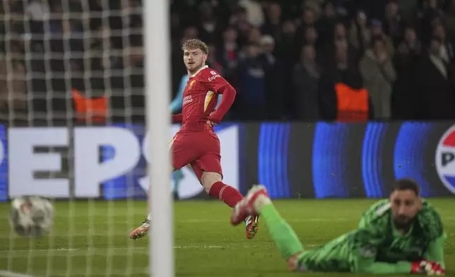 Liverpool's Harvey Elliott scores the opening goal past PSG's goalkeeper Gianluigi Donnarumma during the Champions League round of 16 first leg soccer match between Paris Saint-Germain and Liverpool at the Parc des Princes in Paris, Wednesday, March 5, 2025. (AP Photo/Aurelien Morissard)