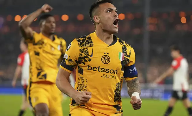 Inter Milan's Lautaro Martinez celebrates after scoring during the Champions League round of 16 first leg soccer match between Feyenoord and Inter Milan in Rotterdam, Netherlands, Wednesday, March 5, 2025. (AP Photo/Peter Dejong)