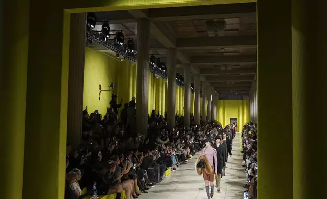 Models wear creations as part of the Miu Miu Fall/Winter 2025-2026 Womenswear collection presented Tuesday, March 11, 2025. in Paris. (Photo by Scott A Garfitt/Invision/AP)