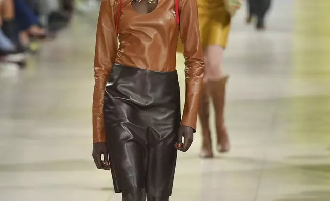A model wears a creation as part of the Miu Miu Fall/Winter 2025-2026 Womenswear collection presented Tuesday, March 11, 2025. in Paris. (Photo by Scott A Garfitt/Invision/AP)