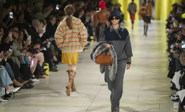 A model wears a creation as part of the Miu Miu Fall/Winter 2025-2026 Womenswear collection presented Tuesday, March 11, 2025. in Paris. (Photo by Scott A Garfitt/Invision/AP)