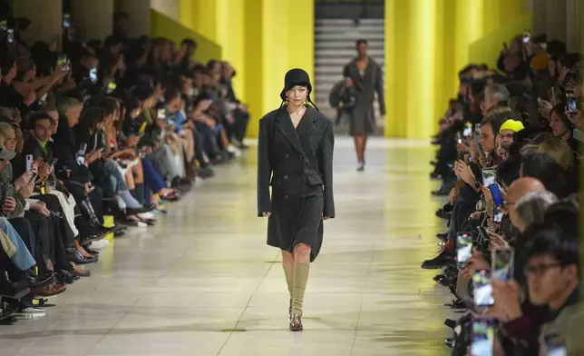 Gigi Hadid wears a creation as part of the Miu Miu Fall/Winter 2025-2026 Womenswear collection presented Tuesday, March 11, 2025. in Paris. (Photo by Scott A Garfitt/Invision/AP)