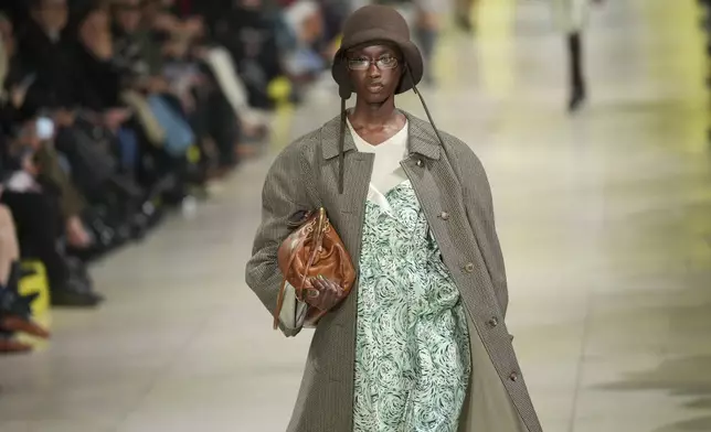 A model wears a creation as part of the Miu Miu Fall/Winter 2025-2026 Womenswear collection presented Tuesday, March 11, 2025. in Paris. (Photo by Scott A Garfitt/Invision/AP)